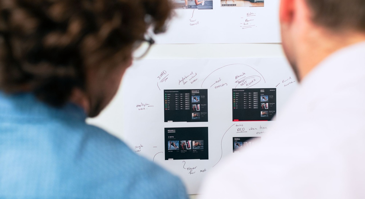 Architecture team reviews the cost and phase plan of a Magento to MACH migration